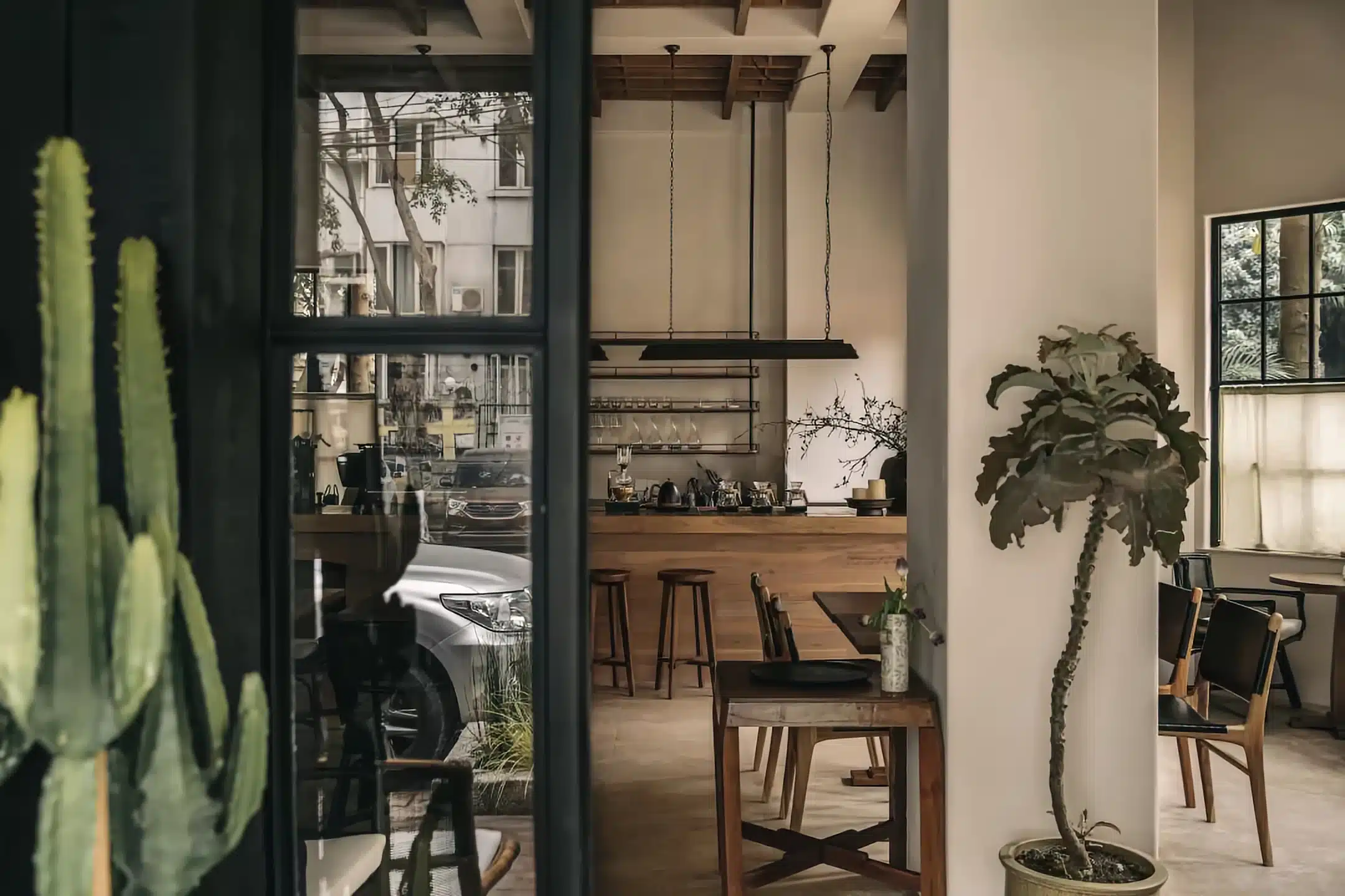 專業咖啡吧台設計，包含義式咖啡機配置、給排水系統與外帶窗口細節。